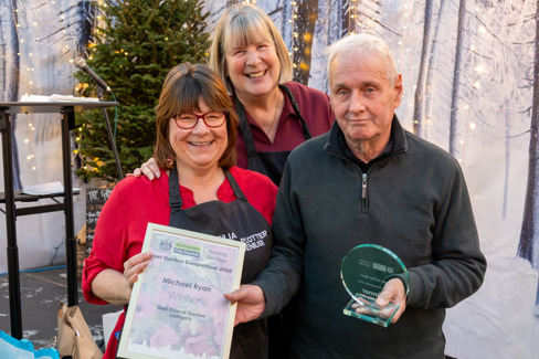 A picture of Michael Ryan being presented with his Best Overall Garden award and trophy
