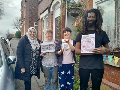 Lindum Grove Community Garden volunteers receiving their award from Cllr Neghat Khan